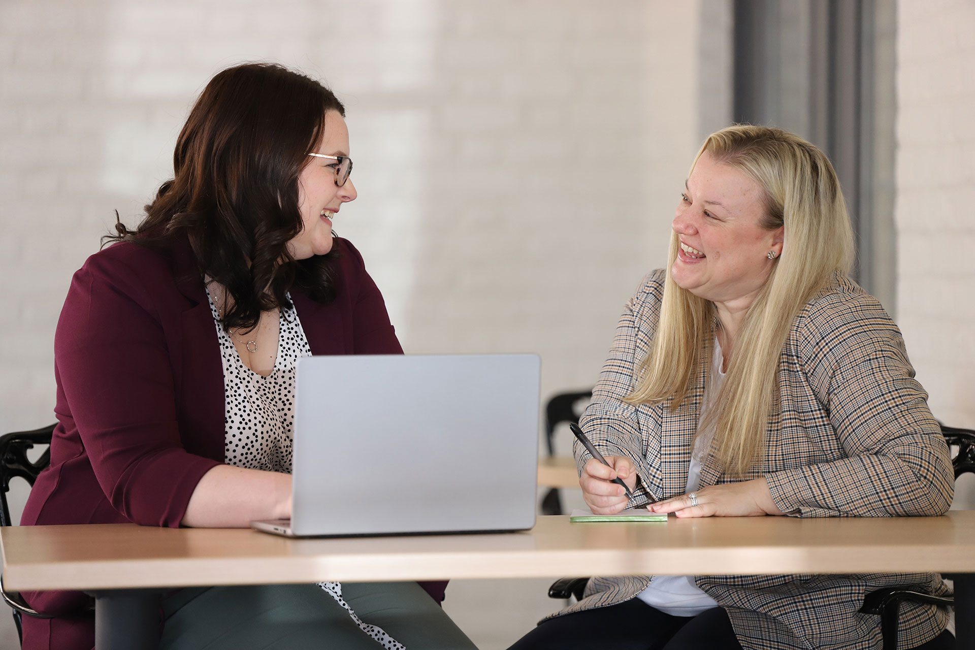 A couple of Glatfelter associates smiling while working together