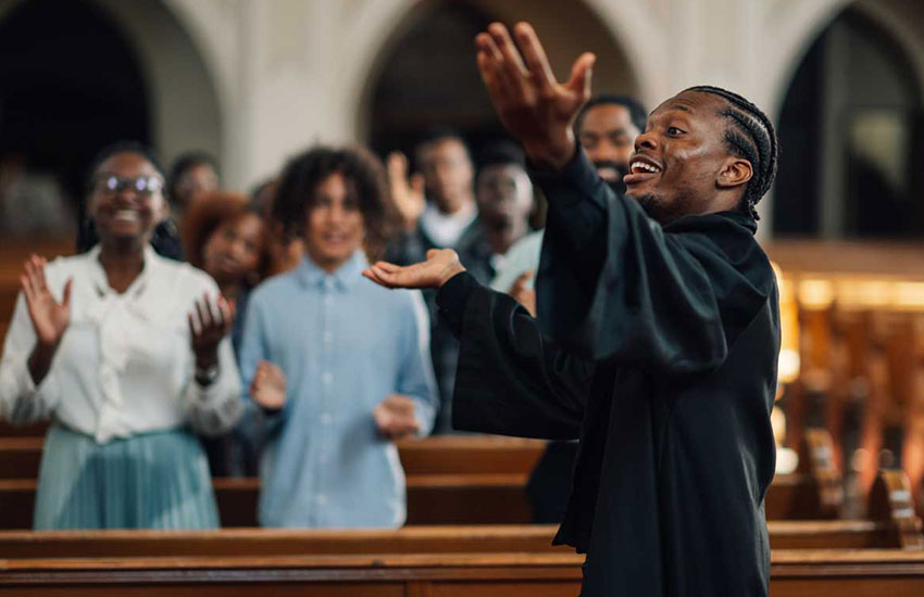 Choir leader singing with the members of a church