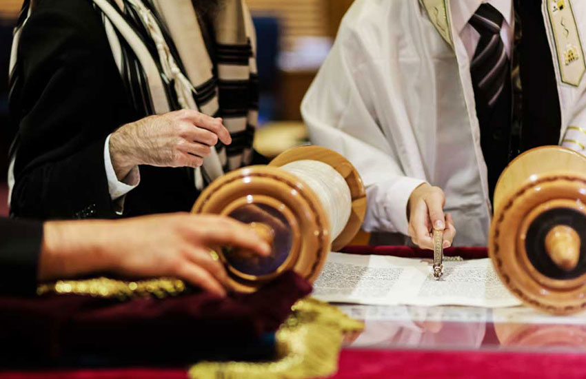 People of Jewish faith reading from the Torah